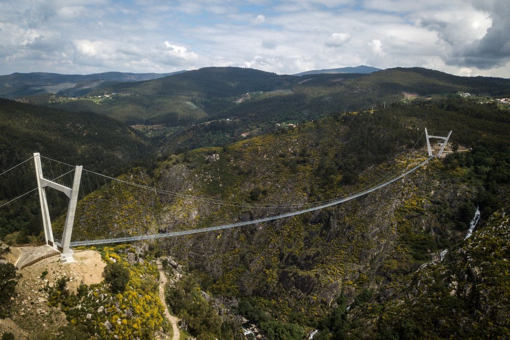 An aerial view shows the 516 Arouca Bridge, the world's longest pedestrian suspension bridge with a length of 516 metres and a height of 175 metres, in Arouca in northern Portugal on April 29, 2021. u00e2u20acu201d AFP picn