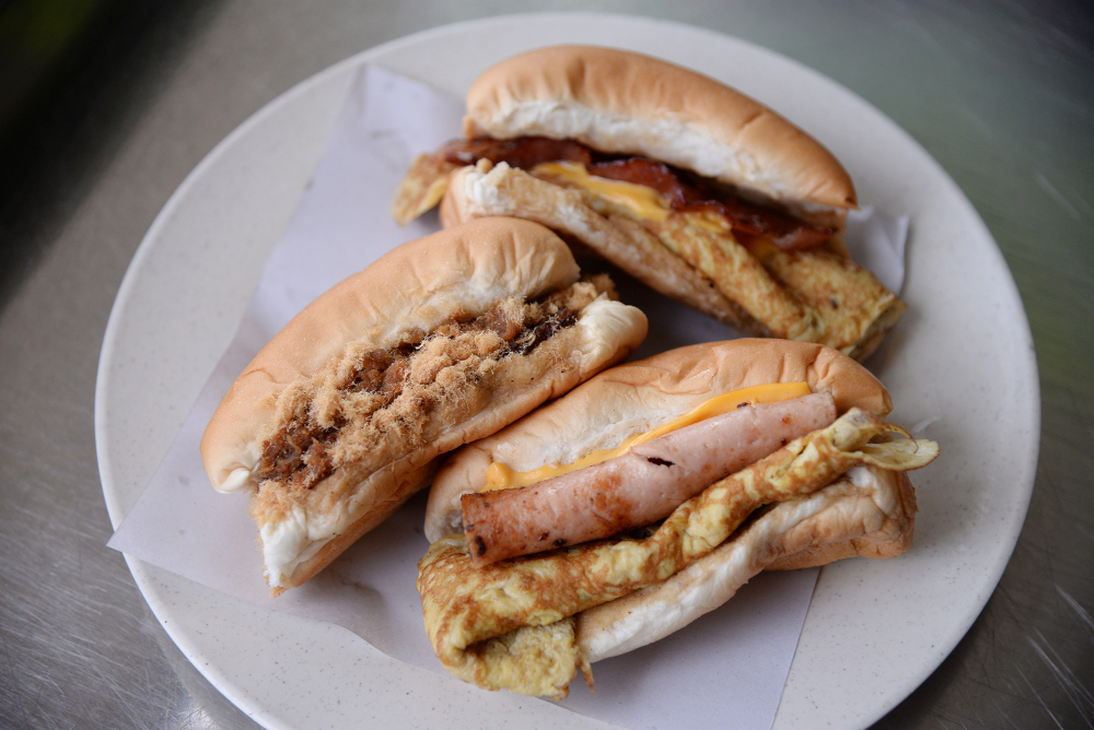 (From top clockwise) Pork Bacon with cheese and egg bun, ham with cheese and egg bun and Bak Kua and Bak Hu bun. 