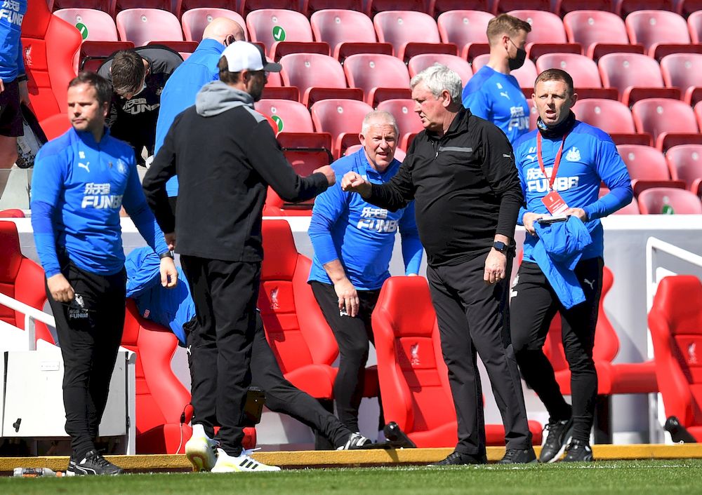Newcastle United manager Steve Bruce bumps fists with Liverpool manager Juergen Klopp at the end of their Premier League match at Anfield, Liverpool, April 24, 2021. u00e2u20acu201d Pool picture via Reuters