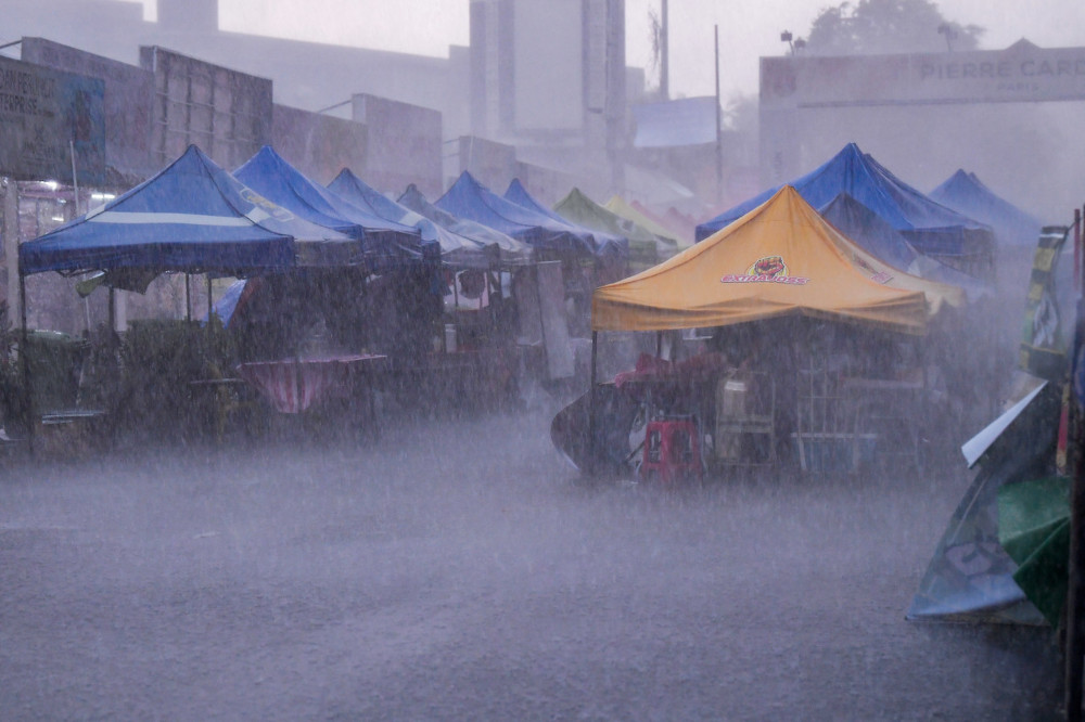 Heavy rain and strong winds prevented traders from selling their food at the Kampung Baru Ramadan bazaar, April 13, 2021. — Bernama pic 