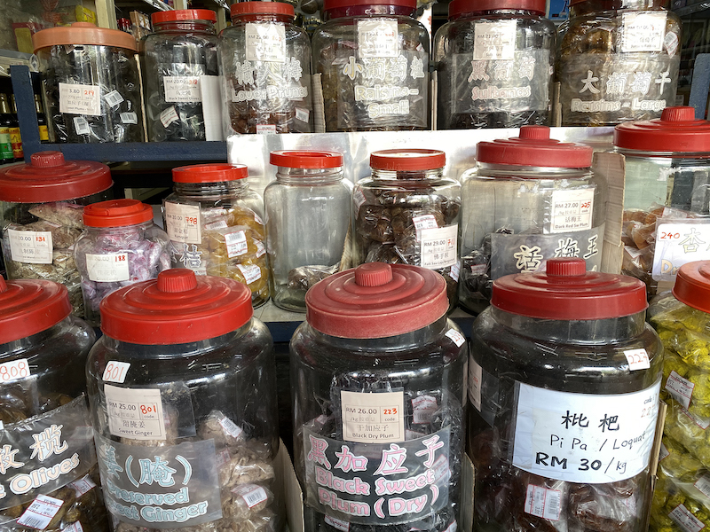 Various types of food items are kept in the old large glass jars. — Picture by KE Ooi