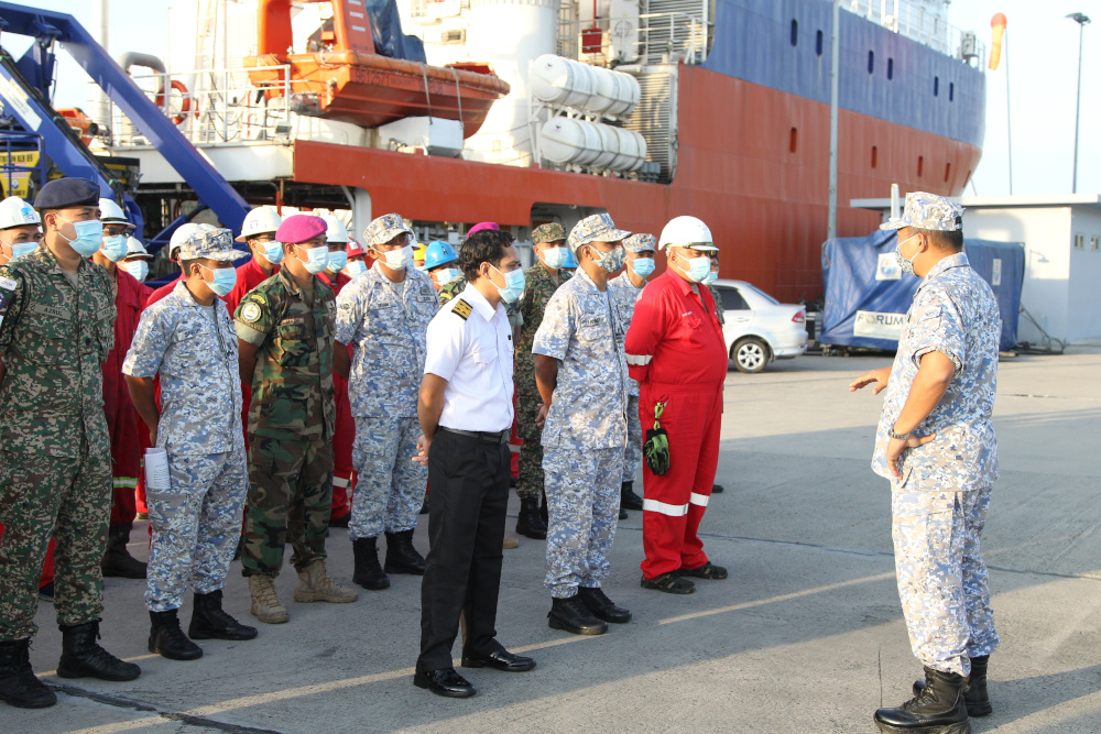 Members of the Royal Malaysian Navy and crew prepare to board a ship to join the search mission of the missing Indonesiau00e2u20acu2122s submarine KRI Nanggala-402, in Kota Kinabalu, April 22, 2021. u00e2u20acu201d Royal Malaysian Navy handout pic via Reuters