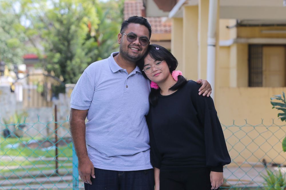 Saiful Nizam Abdul Wahab and daughter Ain Husniza Saiful Nizam pose for a picture during an interview with Malay Mail in Puncak Alam April 30, 2021. u00e2u20acu201d Picture by Yusof Mat Isa