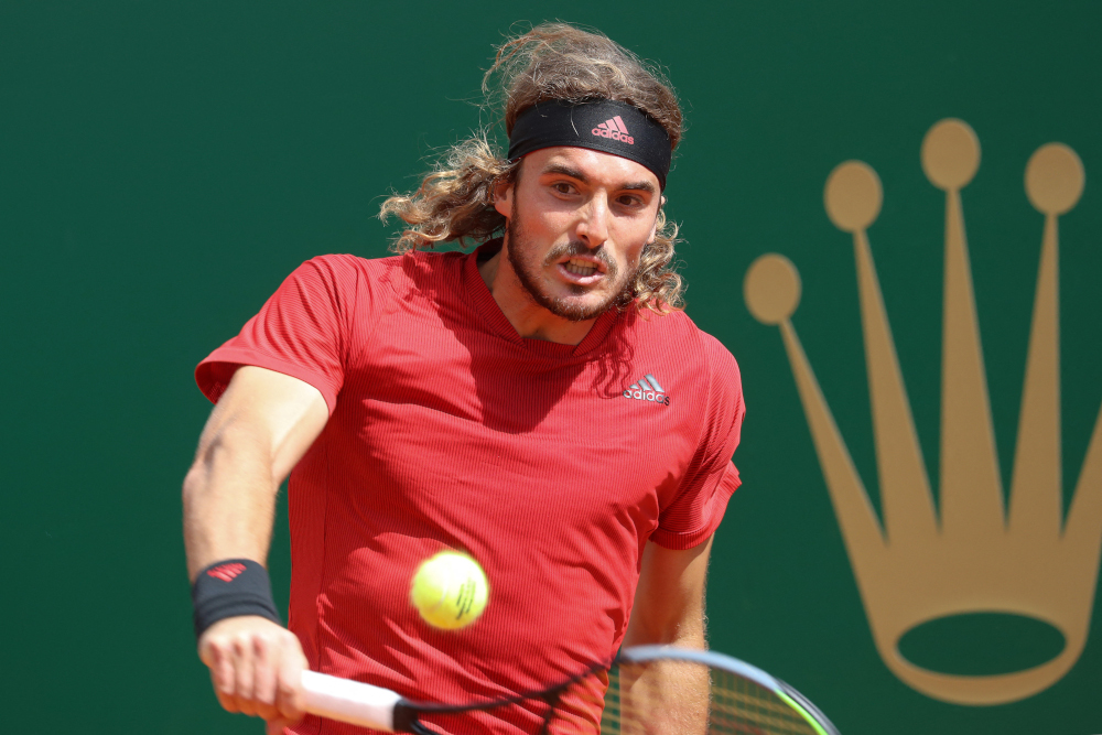 Greeceu00e2u20acu2122s Stefanos Tsitsipas returns the ball to Russiau00e2u20acu2122s Aslan Karatsev during their second round singles match on day three of the Monte-Carlo ATP 1000 Masters Series tennis tournament in Monte-Carlo, Monaco April 13, 2021. u00e2u20acu201d AFP pic 