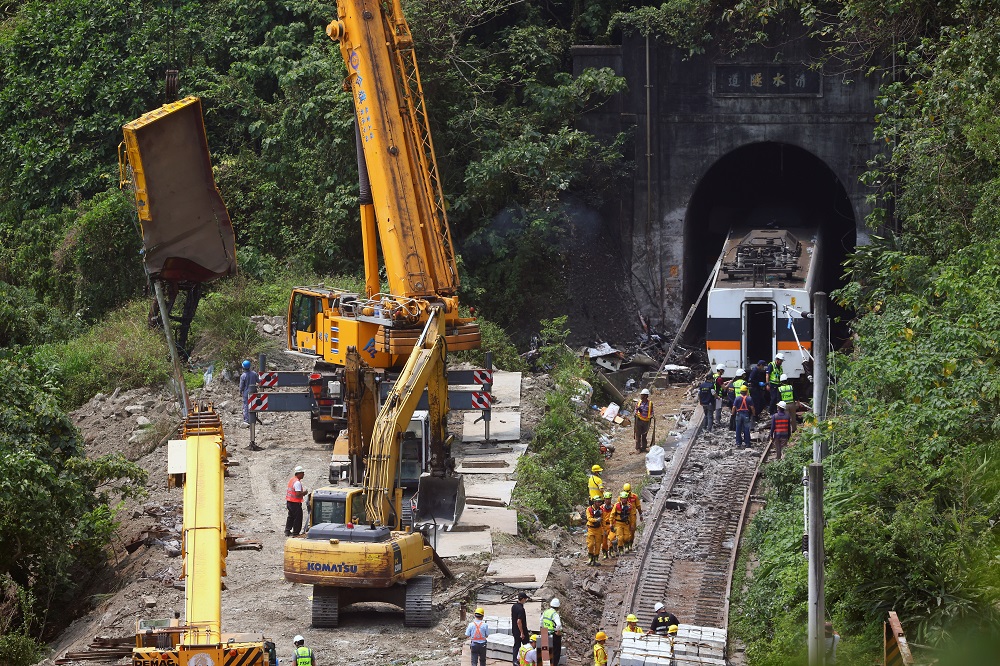 A crane lifts the wreckage of a truck which was hit by the train a day after the deadly train derailment at a tunnel north of Hualien, Taiwan April 3, 2021. u00e2u20acu2022 Reuters pic
