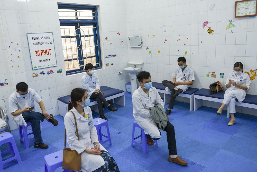 Health workers wait for their turn as Vietnam starts its official rollout of AstraZeneca's Covid-19 vaccine for health workers, at Hai Duong Hospital for Tropical Diseases, Hai Duong province, Vietnam March 8, 2021. u00e2u20acu201d Reuters pic