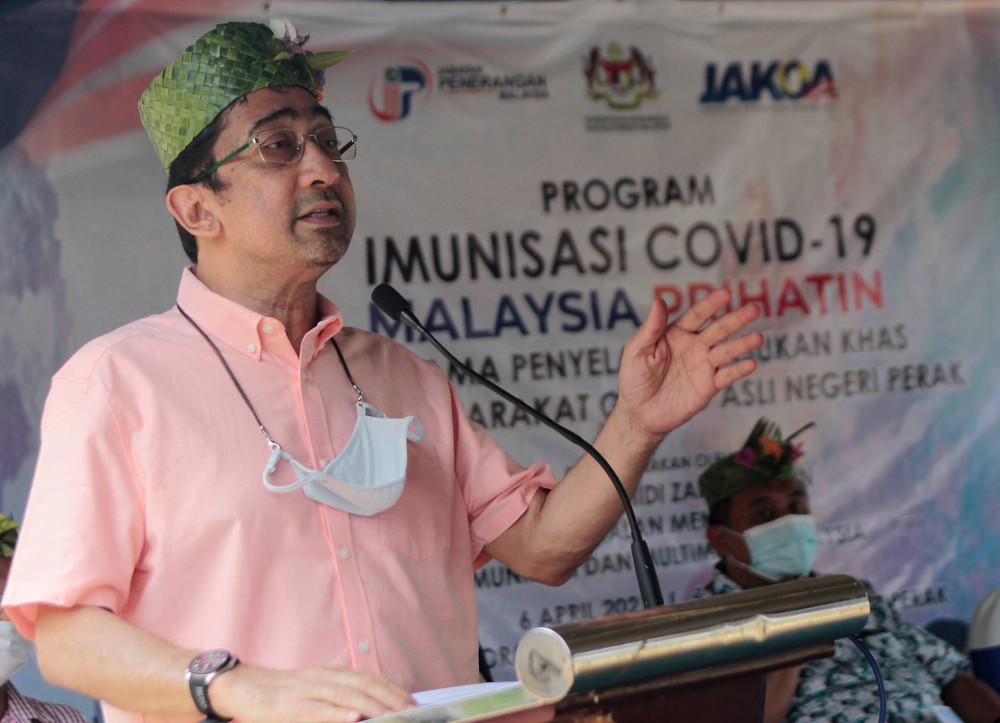 Deputy Communications and Multimedia Minister Datuk Zahidi Zainul Abidin speaks at the launch of  the Malaysia Prihatin Covid-19 Immunisation programme for the Orang Asli community in Kampung Sungai Teras, Slim River, April 6, 2021. u00e2u20acu201d Bernama pic 
