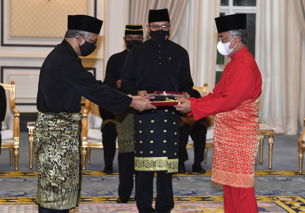 The Yang di-Pertuan Agong presenting the letter of appointment to the Federal Territory Islamic Religious Council Chairman Datuk Mohd Daud Bakar in conjunction with Nuzul Al-Quran at the National Palace, April 29, 2021. u00e2u20acu201d Bernama pic 