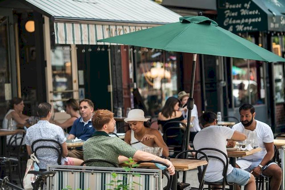 People enjoy al fresco dining at bars and restaurants in the West Village neighbourhood in New York City, US, July 5, 2020. u00e2u20acu201d Reuters pic