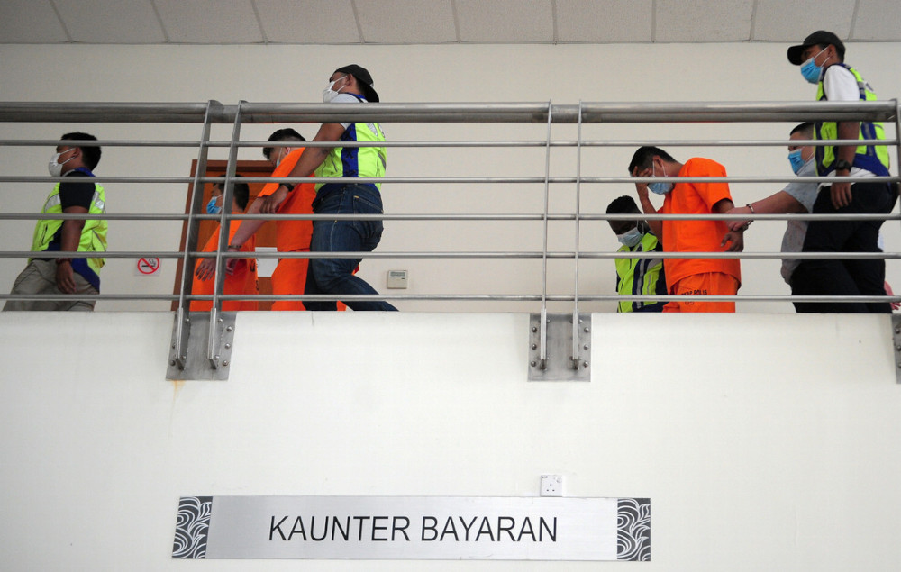 The four individuals were arrested by the police yesterday in connection with an assault on two men by their employer, allegedly for fasting. u00e2u20acu201d Bernama pic 