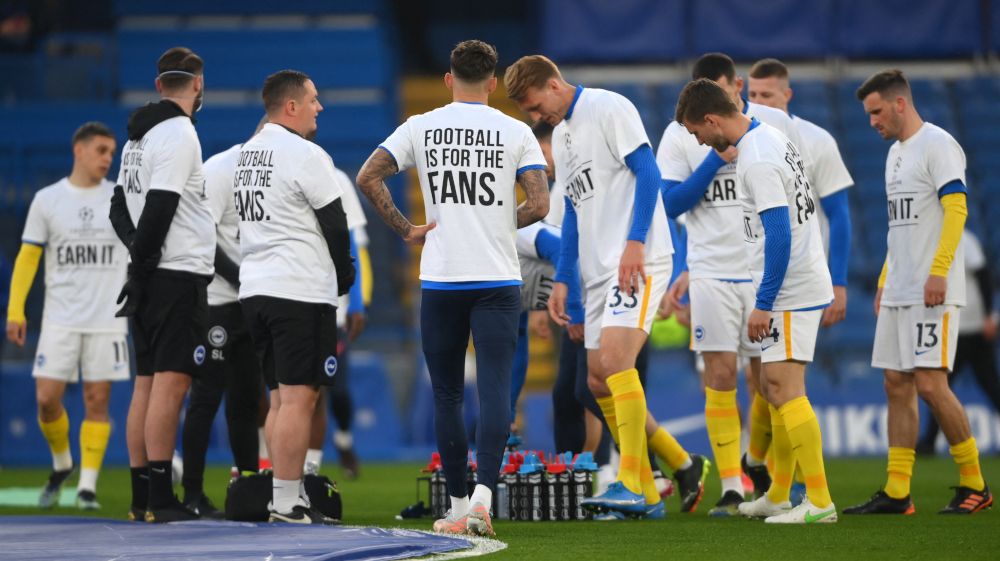 Brighton players wear Uefa Champions League an anti-European Super League T-shirts as they warm up ahead of the English Premier League football match between Chelsea and Brighton and Hove Albion at Stamford Bridge in London April 20, 2021. u00e2u20acu201d AFP pic 