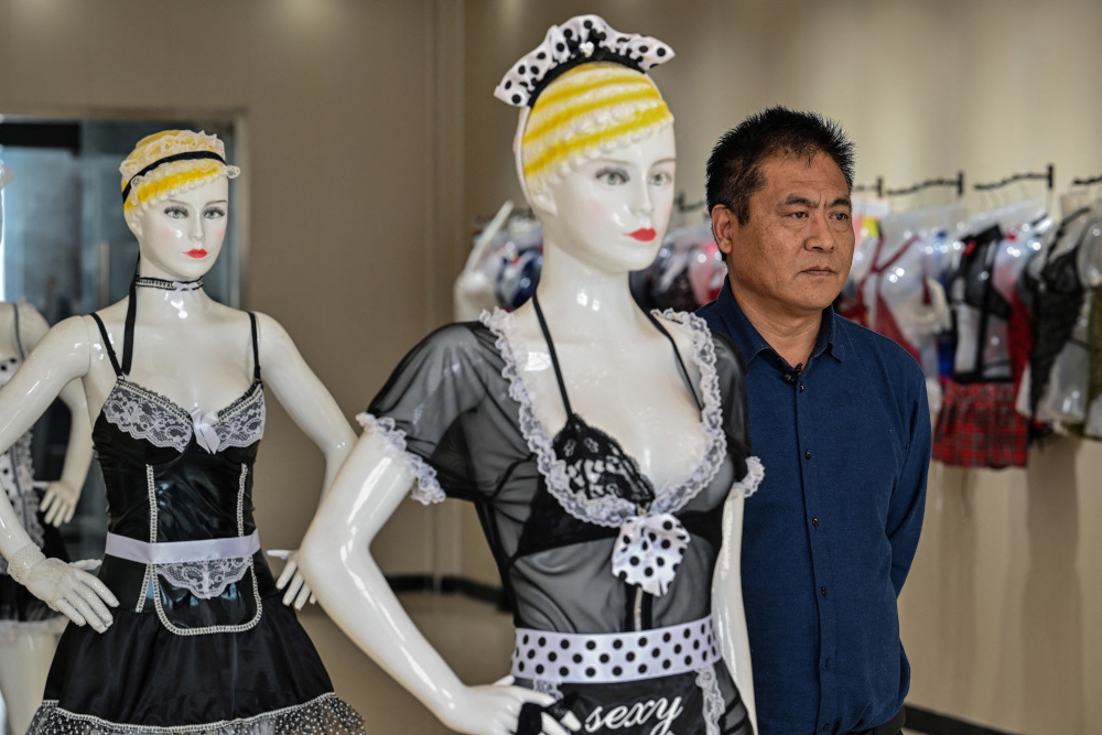 This photo taken March 25, 2021 shows Chang Kailin posing during an interview with AFP at his lingerie factory in Guanyun county, some 50km from Lianyungang in Chinau00e2u20acu2122s north-eastern Jiangsu province. u00e2u20acu201d AFP picnn