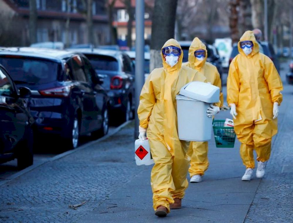 A medical staff of general practitioners walk to their coronavirus disease (Covid-19) test centre set up outside a doctoru00e2u20acu2122s office in a tent at Berlinu00e2u20acu2122s Reinickendorf district, Germany, March 23, 2020. u00e2u20acu201d Reuters pic
