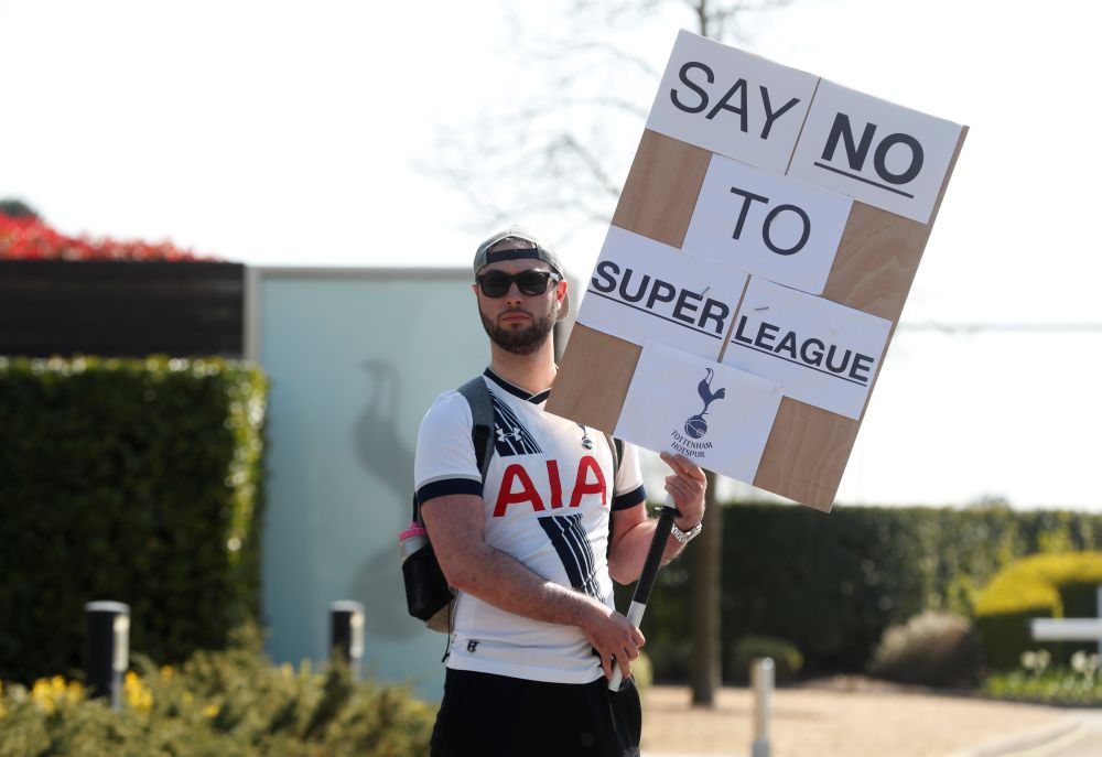 A Tottenham Hotspur fan holds an anti-Super League banner outside the Tottenham Hotspur Training Centre in London April 19, 2021. u00e2u20acu201d Reuters pic