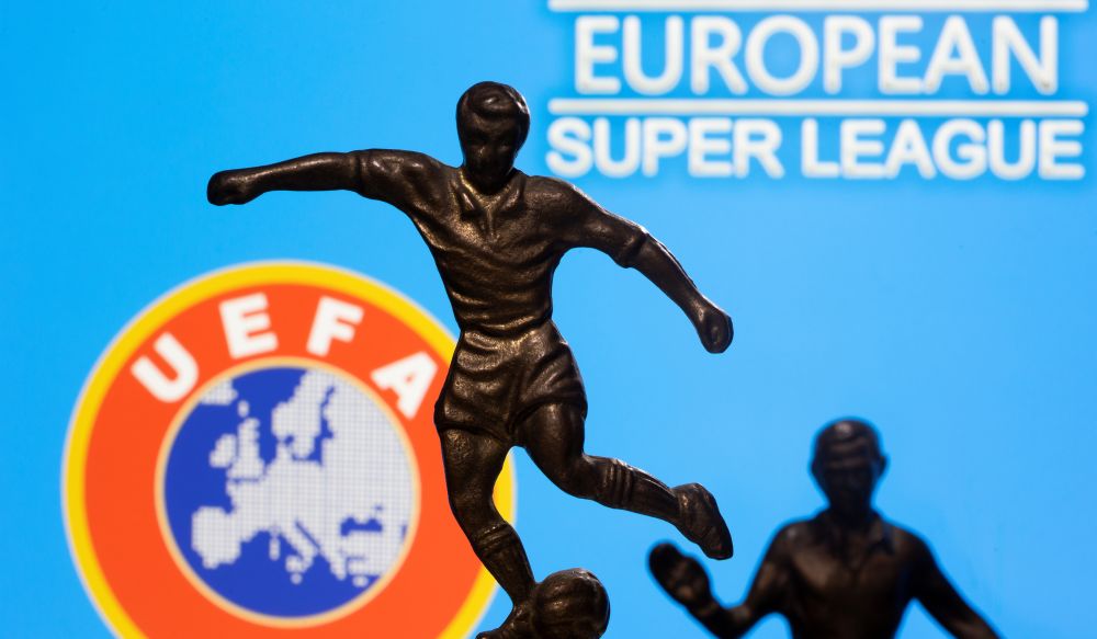 Metal figures of football players are seen in front of the words u00e2u20acu02dcEuropean Super Leagueu00e2u20acu2122 and the Uefa logo in this illustration taken April 20, 2021. u00e2u20acu201d Reuters pic