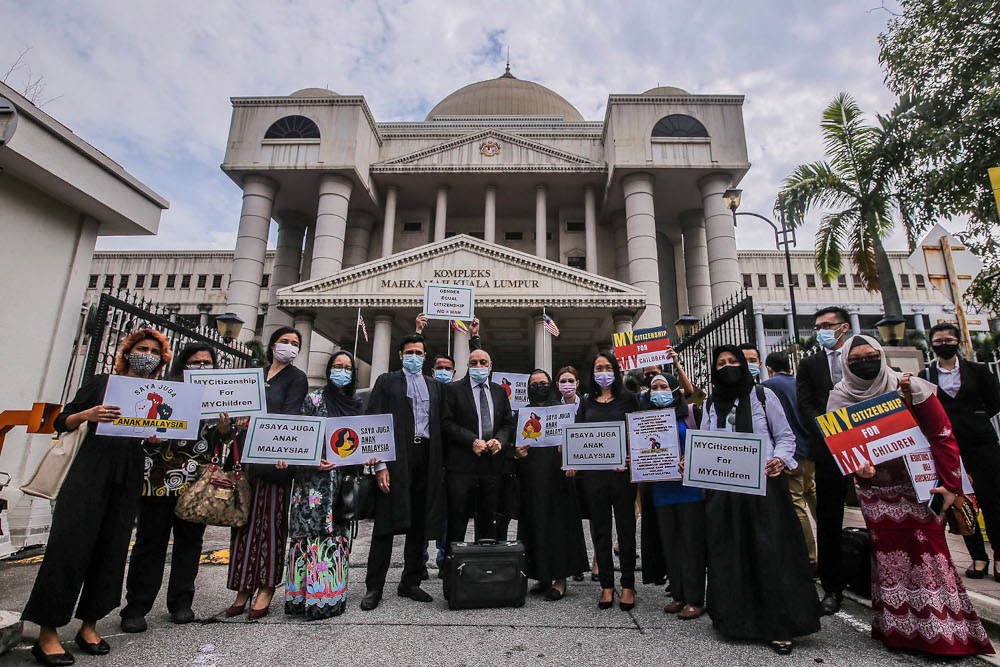 Members of Family Frontiers and the affected Malaysian mothers are seen holding placards to say that their children should also have the right to be Malaysian citizens. April 27, 2021. ― Picture by Hari Anggara