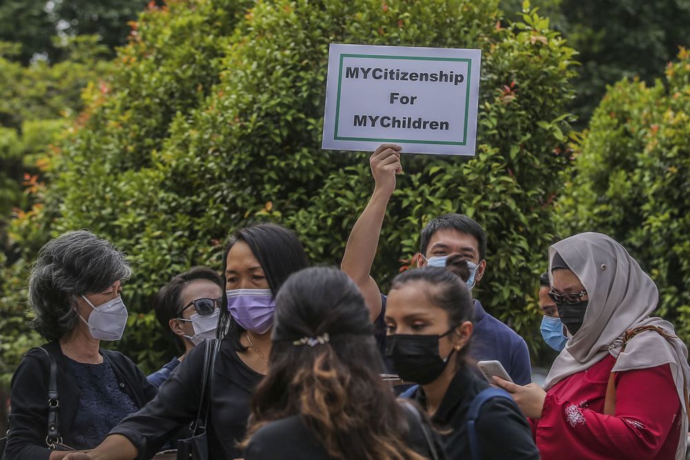 Members of Family Frontiers hold up placards demanding equal citizenship rights for Malaysians at the Kuala Lumpur High Court April 27, 2021. u00e2u20acu201d Picture by Hari Anggara
