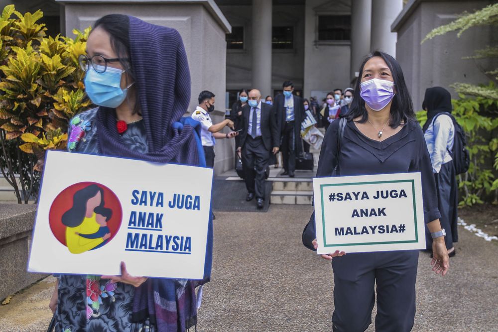 Members of Family Frontiers hold up placards demanding equal citizenship rights for Malaysians at the Kuala Lumpur High Court April 27, 2021. u00e2u20acu201d Picture by Hari Anggara