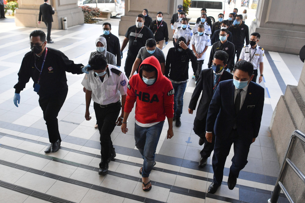 The eight Filipino men at the Magistratesu00e2u20acu2122 Court in Kuala Lumpur, April 22, 2021. u00e2u20acu201d Bernama pic 