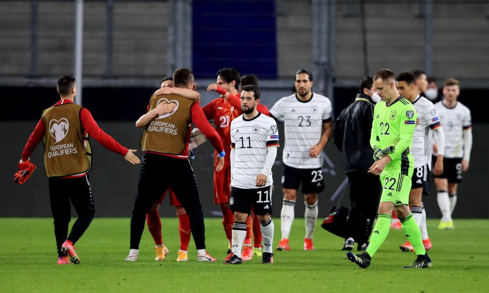 Germany players look dejected as the North Macedonia players celebrate after the match at MSV-Arena, Duisburg March 31, 2021. u00e2u20acu201d Reuters pic