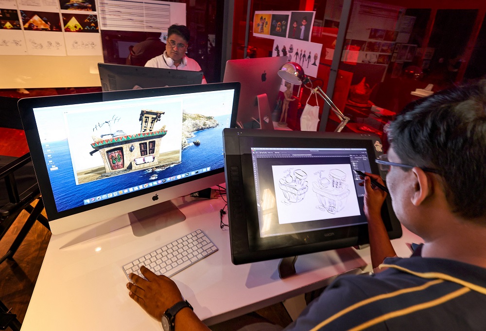Graphic artists from Boss Bunny Games work at the Lammtara Animation Studios in Dubai. u00e2u20acu2022 AFP pic via ETX Studio