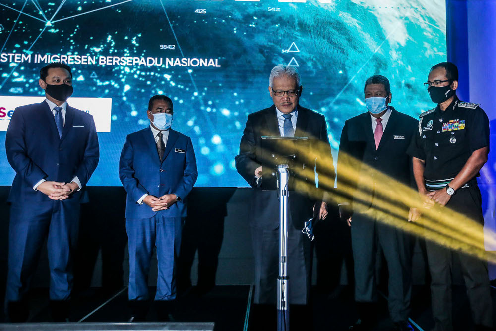 Home Minister Datuk Seri Hamzah Zainudin (centre) at the launch of the new National Immigration Systems at Hilton Kuala Lumpur April 8, 2021. u00e2u20acu2022 Picture by Hari Anggara
