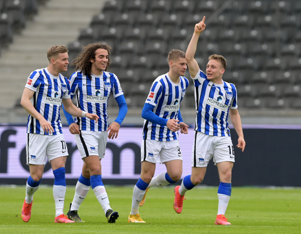 Hertha Berlinu00e2u20acu2122s players celebrate midfielder Santiago Ascacibar (right) after he scored the opening goal during the German first division Bundesliga football match between against Borussia Moenchengladbach in Berlin April 10, 2021. u00e2u20acu201d AFP pic 