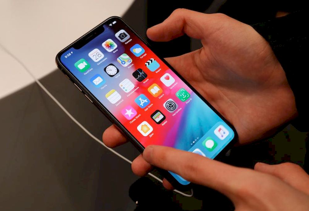 A customer tests a smartphone during the launch of the new iPhone XS and XS Max sales at u00e2u20acu02dcre:Storeu00e2u20acu2122 Apple reseller shop in Moscow, Russia September 28, 2018. u00e2u20acu201d Reuters pic