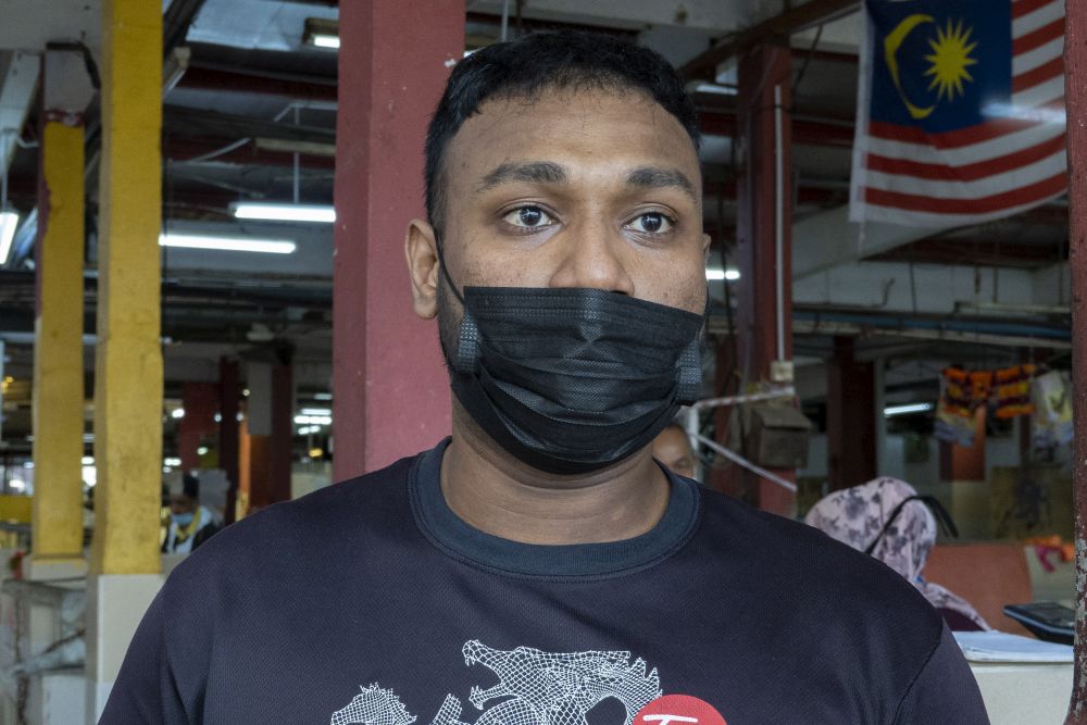 Chicken trader Muhamad Anuar speaks to Malay Mail during a survey at the Jalan Othman wet market in Petaling Jaya April 20, 2021. — Picture by Miera Zulyana