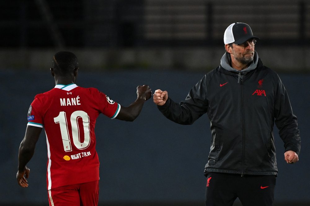 Liverpool manager Jurgen Klopp fist bumps striker Sadio Mane at the end of the Uefa Champions League first leg quarter-final football match against Real Madrid at the Alfredo di Stefano stadium in Valdebebas, April 6, 2021. u00e2u20acu201d AFP picnn