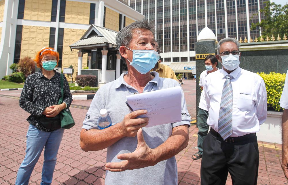 Farmer Tan Tean Chee speaks to reporters outside the Ipoh City Council April 1, 2021. — Picture by Farhan Najib