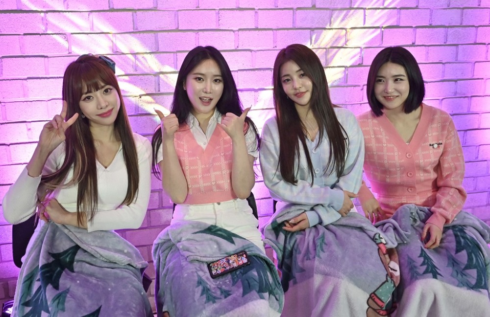 This picture taken on March 27, 2021 shows K-pop group Brave Girls members (left to right) Hong Eun-ji, Kim Min-young, Nam Yu-jeong and Lee Yu-na posing during an interview with AFP after a commercial event at a studio in Gwacheon, south of Seoul. u00e2u20acu2022 AFP