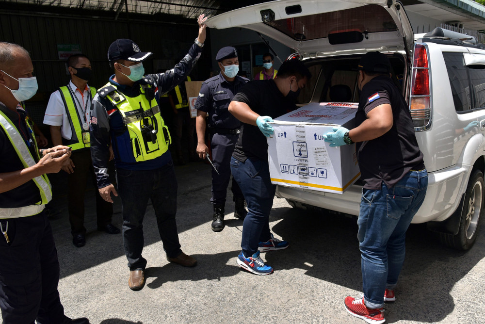 The second batch of 600 doses of Sinovacu00e2u20acu2122s Covid-19 vaccine from Kuala Lumpur arrived at the Labuan Airport amid a surge of Covid-19 clusters on the duty-free-island, April 1, 2021. u00e2u20acu201d Bernama pic
