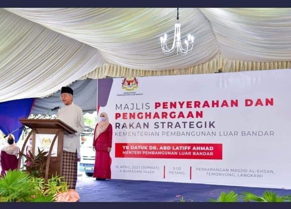 Tun Dr Mahathir Mohamad speaks during an event with the backdrop bearing the name of minister Datuk Abdul Latiff Ahmad from his old party, Parti Pribumi Bersatu Malaysia. u00e2u20acu201d Picture via Facebook/Pemuda Umno Malaysia