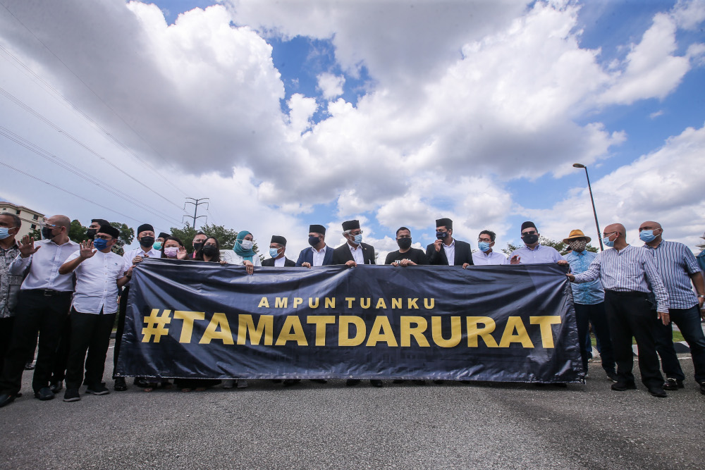 Opposition leaders hold a banner in front of Istana Negara asking for an end to the Emergency, April 20, 2021. ― Picture by Hari Anggara