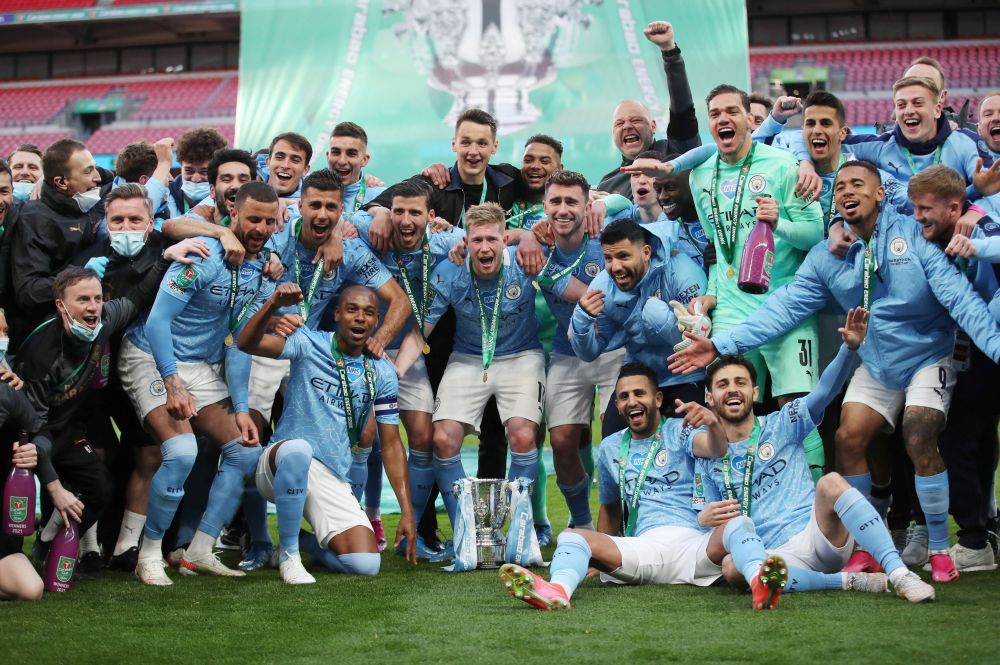 Manchester City players pose with the trophy as they celebrate after winning the Carabao Cup at Wembley Stadium, London April 25, 2021. u00e2u20acu201d Reuters picnn