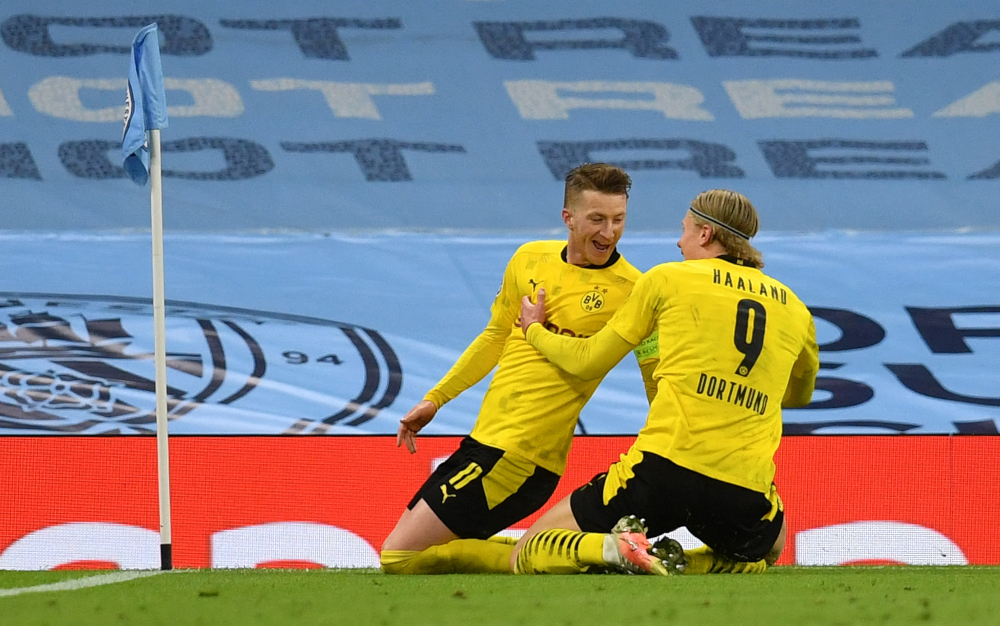 Dortmund forward Marco Reus celebrates after scoring the equalising goal with Erling Braut Haaland during the Uefa Champions League first leg quarter-final match against Manchester City at Etihad Stadium in Manchester, April 6, 2021. u00e2u20acu201d AFP pic  