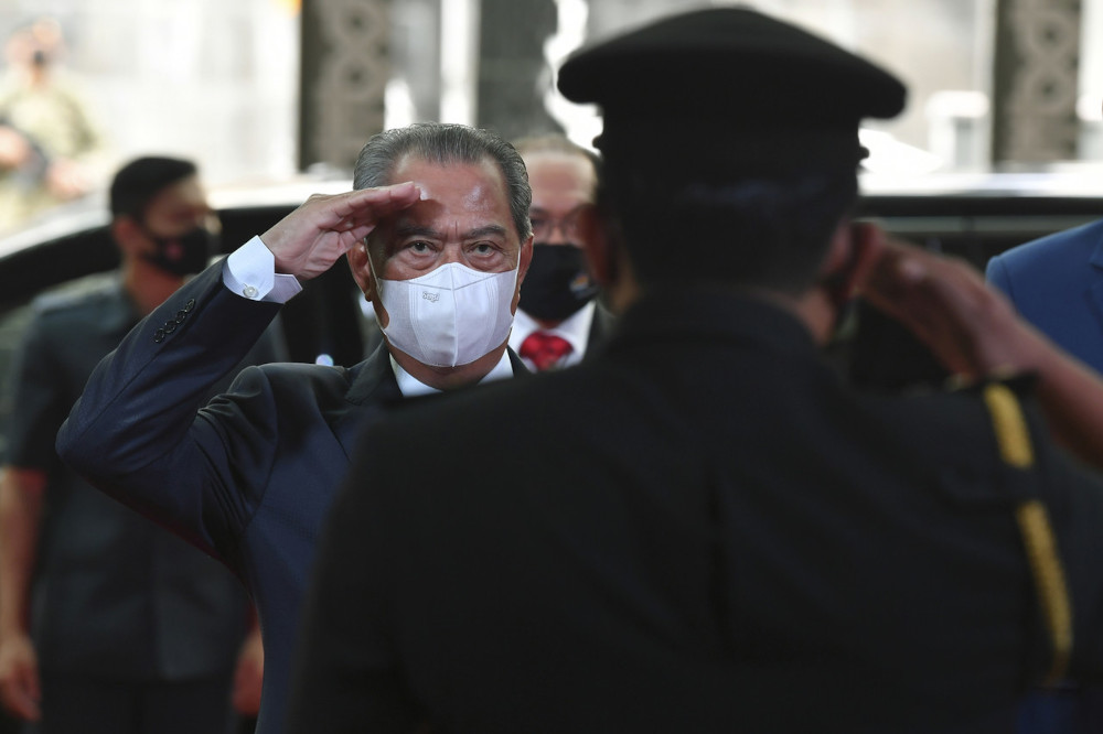 Prime Minister Tan Sri Muhyiddin Yassin salutes the line of Enforcement Officers in conjunction with his work visit to the Enforcement Command Centre of the Ministry of Domestic Trade and Consumer Affairs in Putrajaya, April 23, 2021. u00e2u20acu201d Bernama picnn