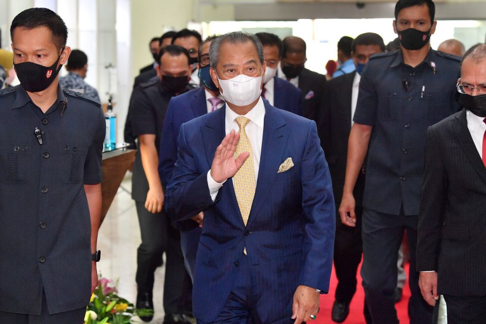 Prime Minister Tan Sri Muhyiddin Yassin waves at reporters at Risda's headquarters in Kuala Lumpur April 27, 2021. u00e2u20acu201d Bernama pic