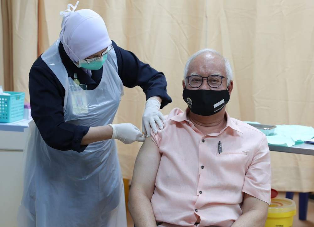 Datuk Seri Najib Razak receiving his first dose of Covid-19 vaccine April 10, 2021. u00e2u20acu201d Picture via Facebook/Najib Razak