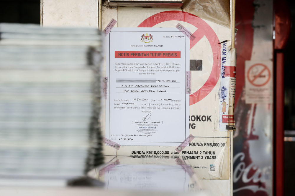 A notice of closure is seen in the vicinity of the restaurant after staff tested positive for Covid 19 at Bayan Baru. April 30, 2021. u00e2u20acu201d Picture by Sayuti Zainudin