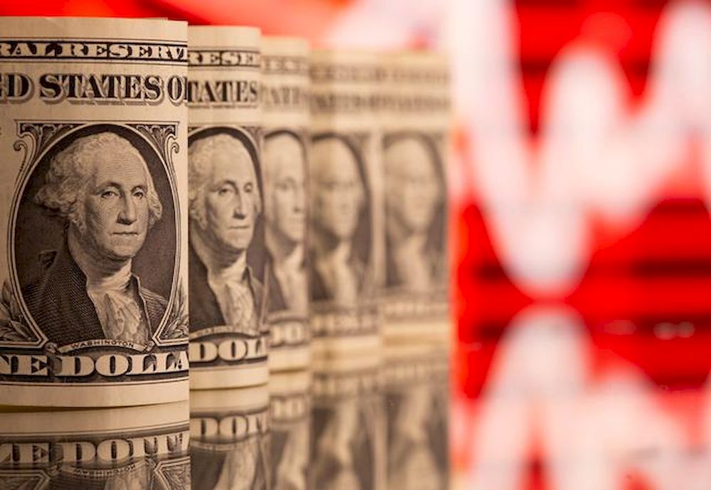US One dollar banknotes are seen in front of displayed stock graph in this illustration taken, February 8, 2021. u00e2u20acu201d Reuters pic