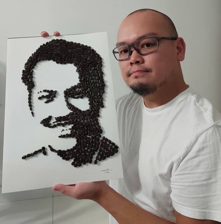 Foo and his artwork featuring the late P. Ramlee. u00e2u20acu201d Picture courtesy of Michael Foo Chee Meng 