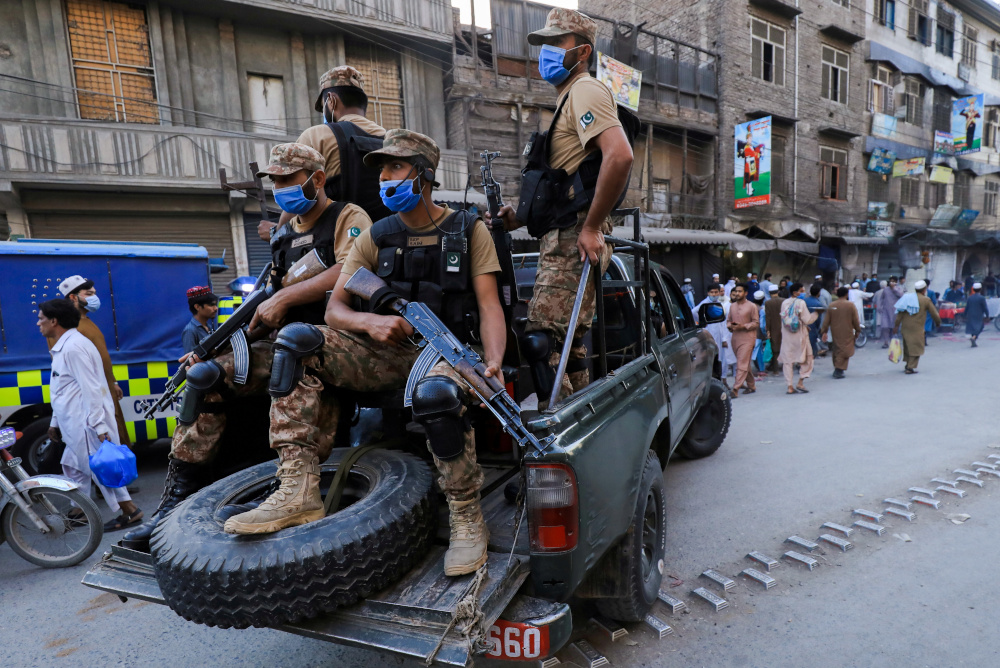 Army soldiers patrol the street, to enforce coronavirus safety protocols, as the spread of Covid-19 continues in Peshawar, Pakistan April 25, 2021. u00e2u20acu201d Reuters pic