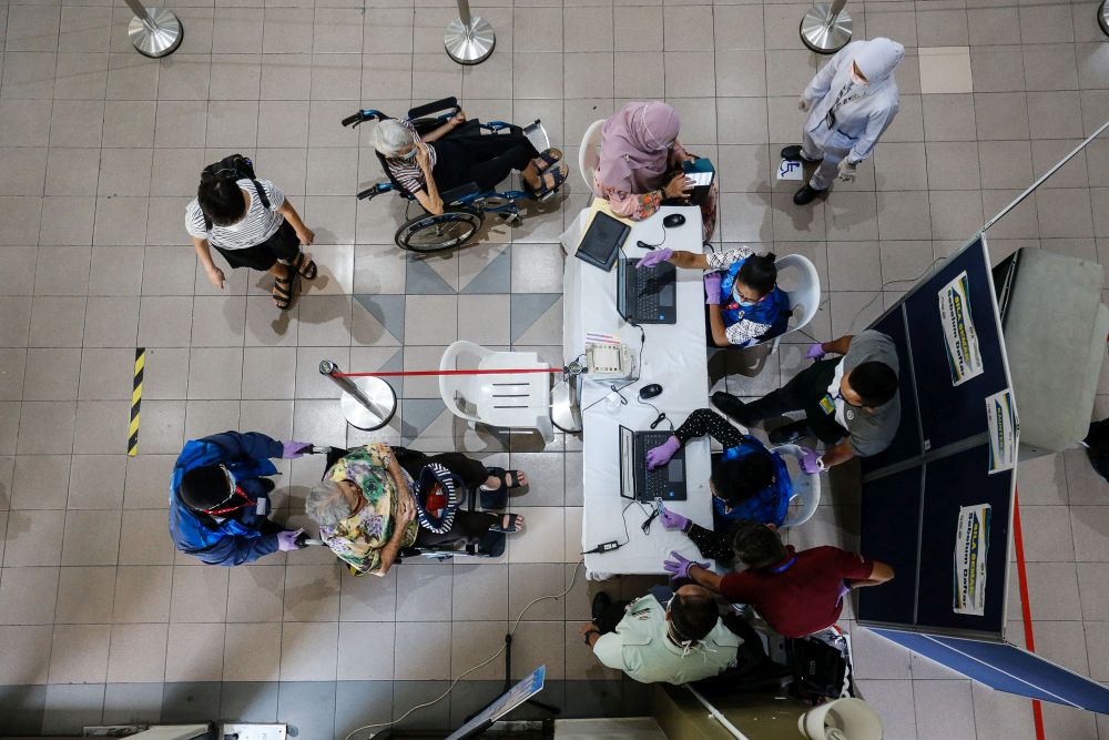 Senior citizens are pictured at the Caring Society Complex to receive their Covid-19 shot under phase two of Penangu00e2u20acu2122s immunisation drive in George Town April 19, 2021. u00e2u20acu201d Picture by Sayuti Zainudinnn
