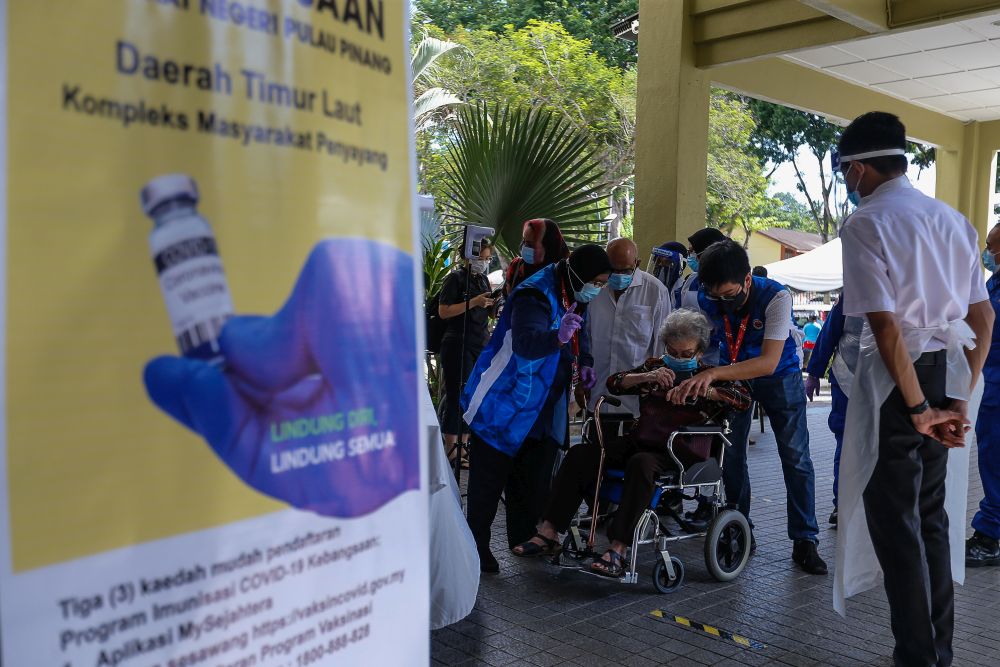 Senior citizens are pictured at the Caring Society Complex to receive their Covid-19 shot under phase two of Penangu00e2u20acu2122s immunisation drive in George Town April 19, 2021. u00e2u20acu201d Picture by Sayuti Zainudinnn