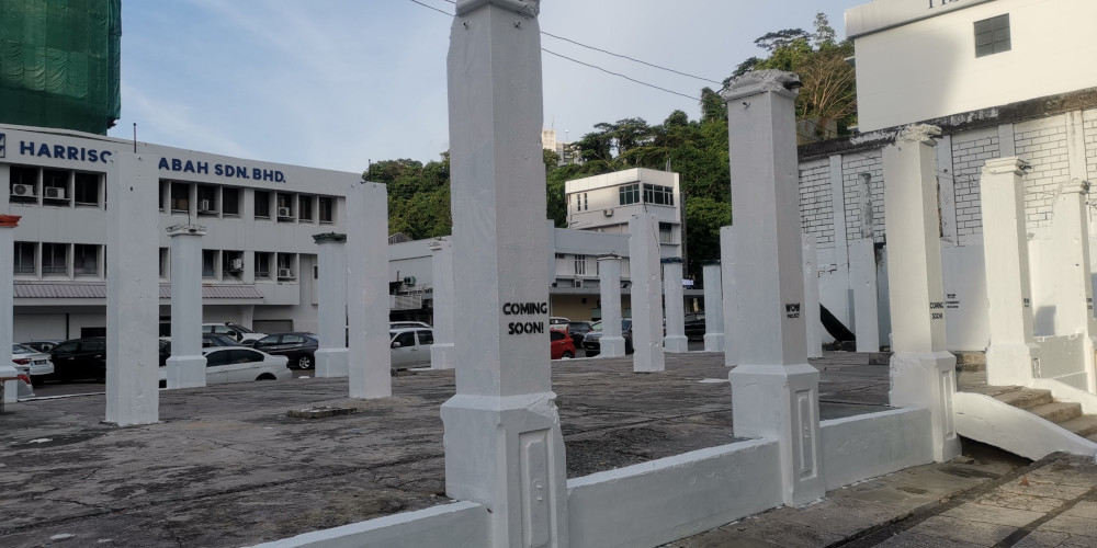 The Pillars of Sabah painted in white. — Borneo Post Online pic