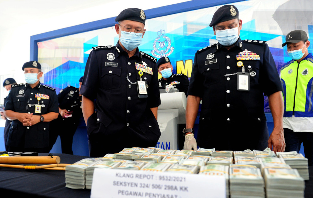 Selangor police chief Datuk Arjunaidi Mohamed views the seized money during a press conference at the South Klang Police Headquarters in Klang, April 15, 2021. u00e2u20acu201d Bernama picnn