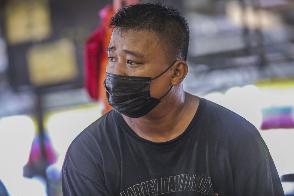 Trader Eddy Irwan speaks to Malay Mail during an interview at the Selayang wholesale market in Kuala Lumpur April 21, 2021. — Picture by Hari Anggara