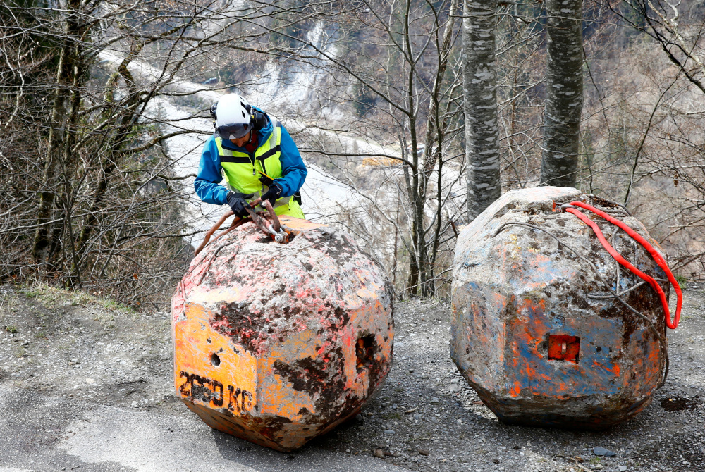 Andrin Caviezel, researcher at the WSL Institute for Snow and Avalanche Research (SLF) checks a 3.200kg ferroconcret block before rockfall experiments in Schiers April 15, 2021. u00e2u20acu201d Reuters pic
